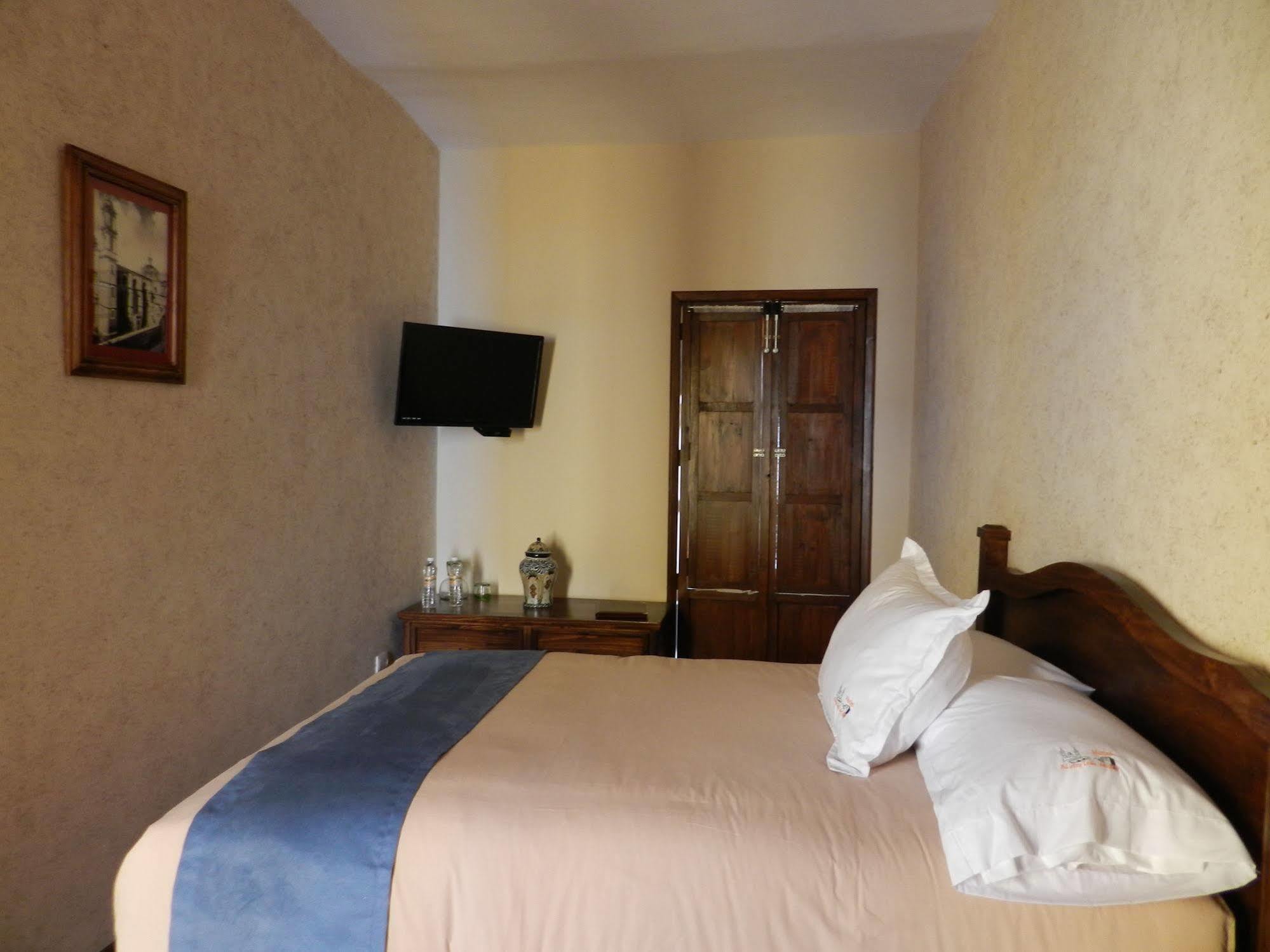 Collection O Al Otro Lado Del Rio, Puebla Hotel Exterior foto A room at the hotel